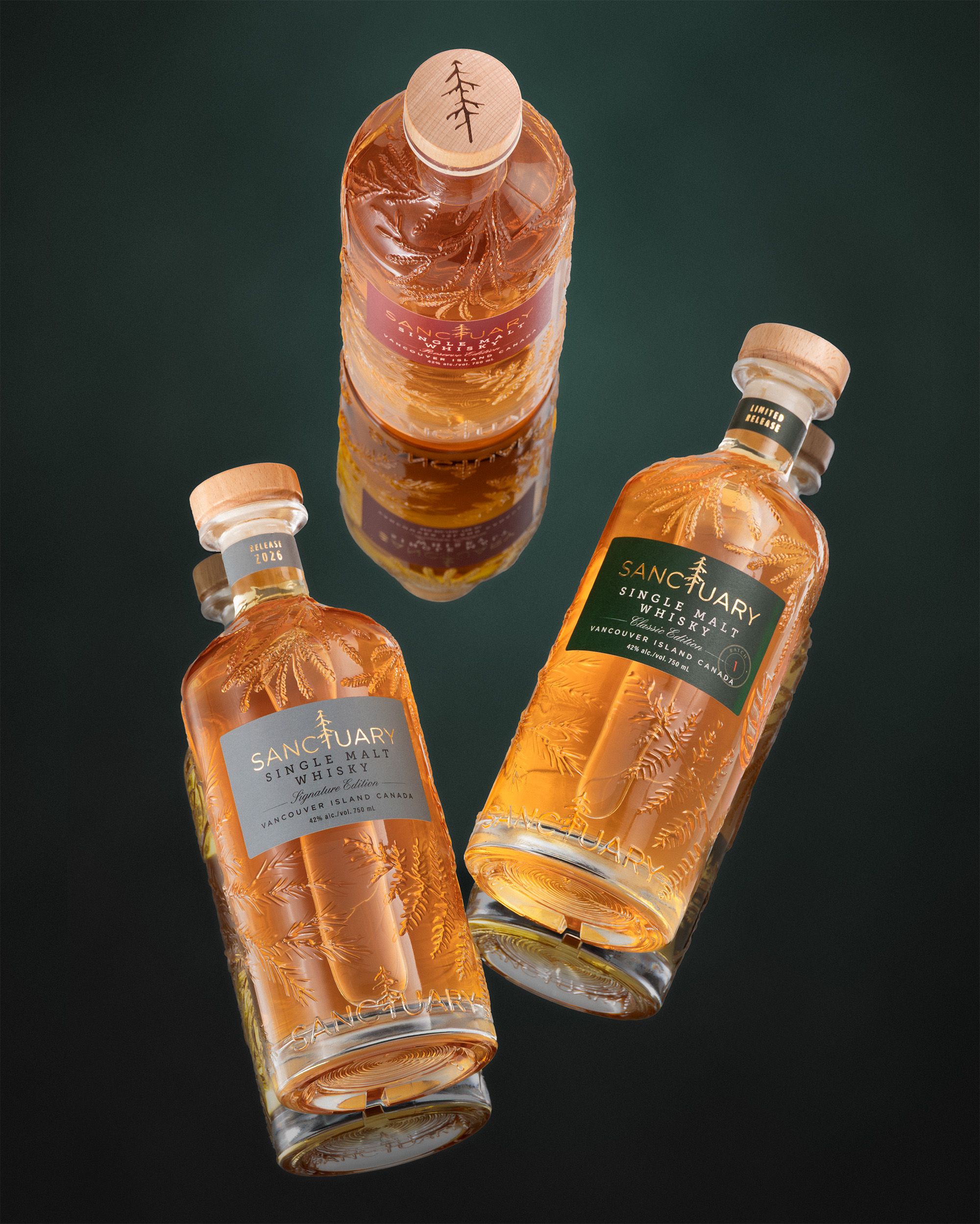 Three Sanctuary Single Malt Whisky bottles floating on a deep green background