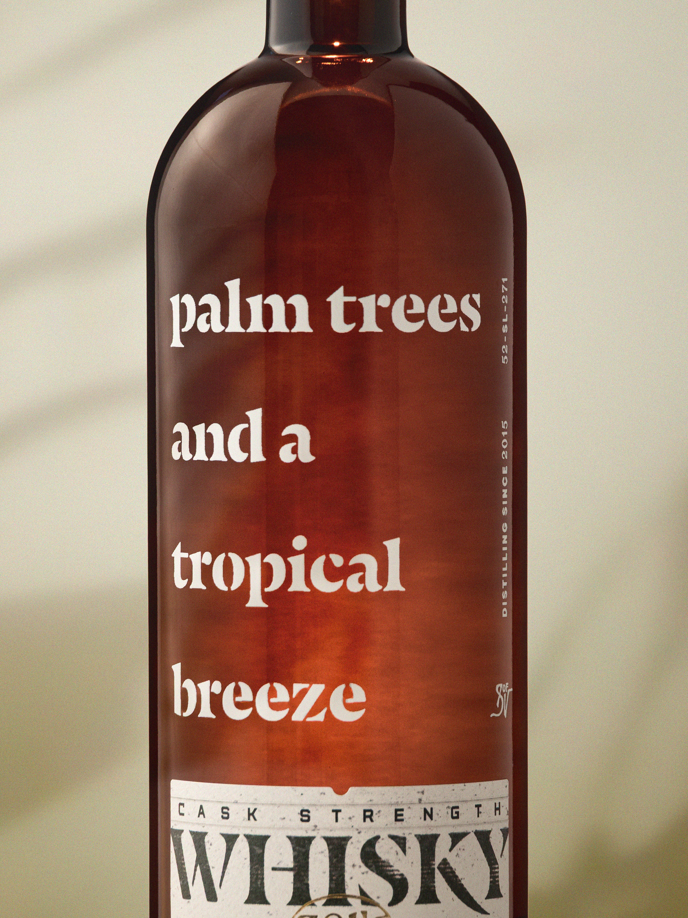 Close detail of the top of the bottle, capsule and neck label