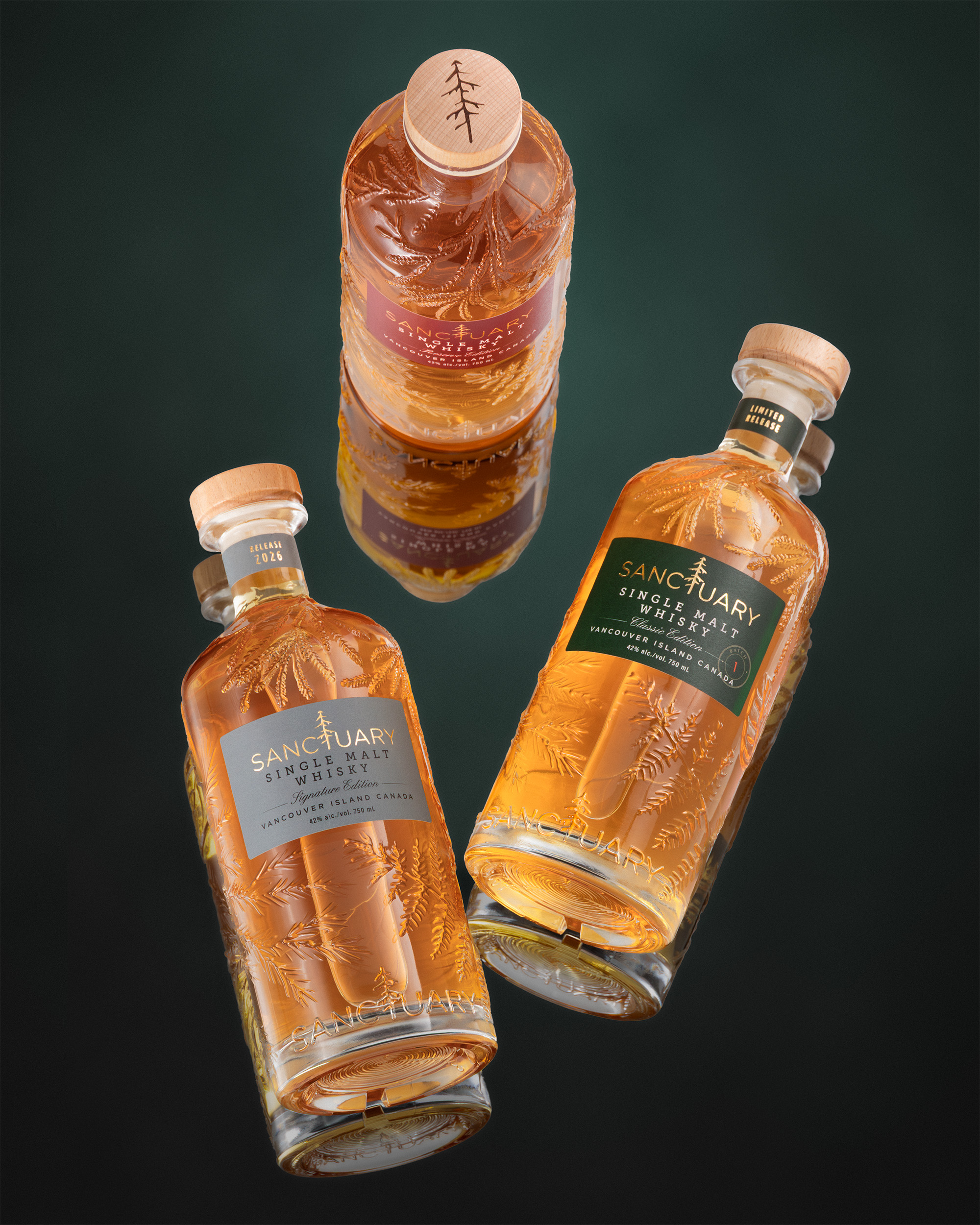 Three Sanctuary Single Malt Whisky bottles floating on a deep green background