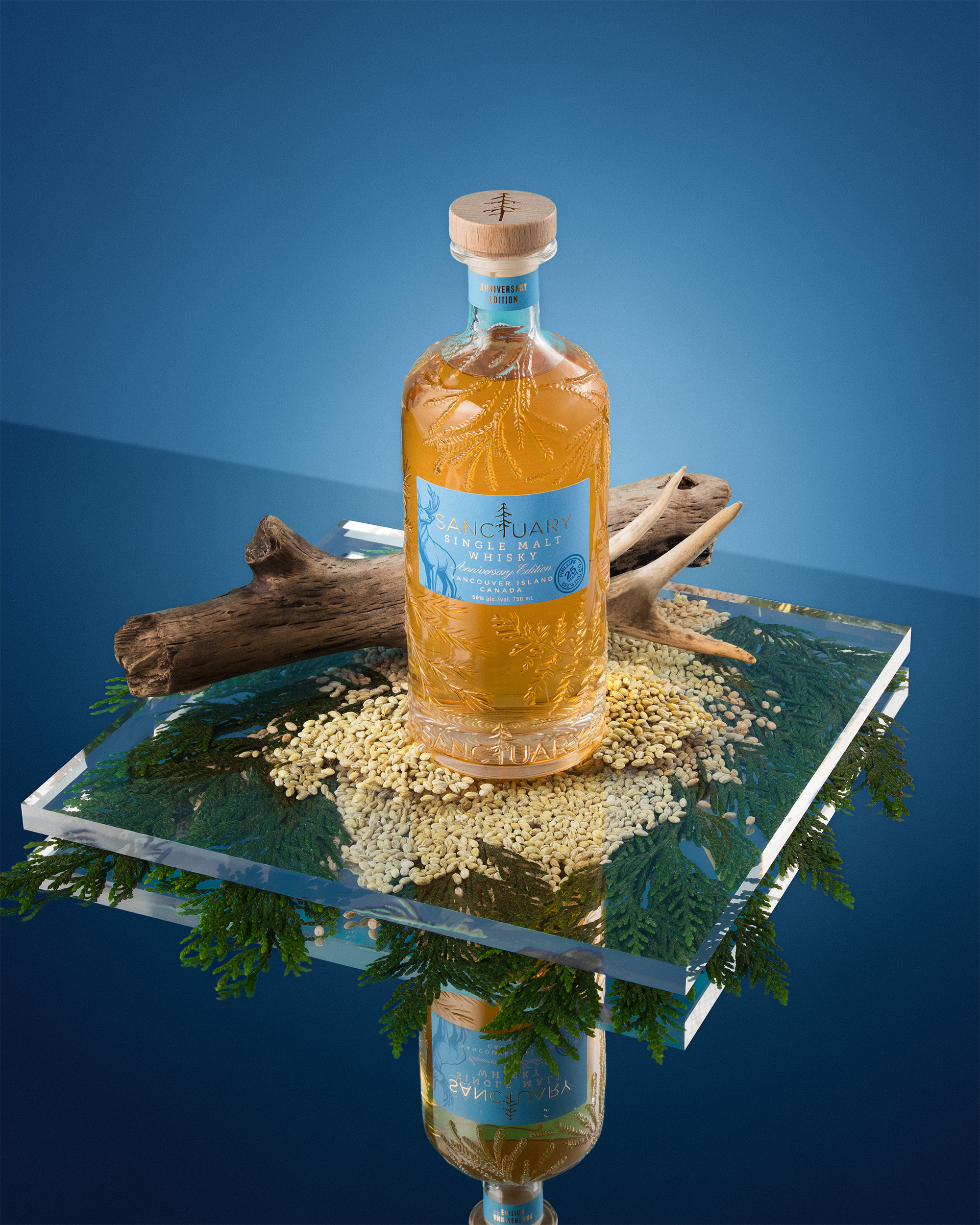Sanctuary Anniversary Edition bottle on glass platform with driftwood and cedar