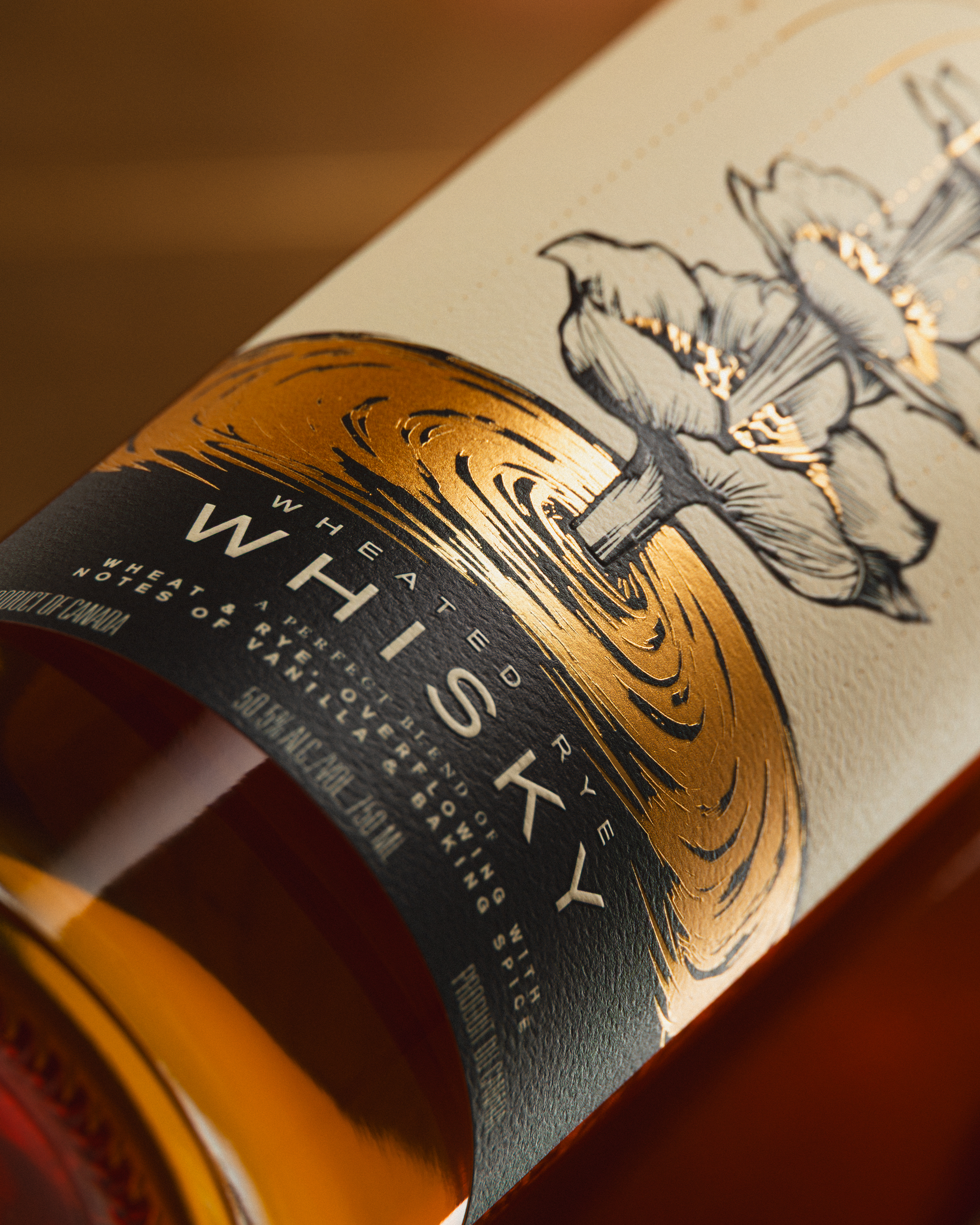 Macro detail of Sons of Vancouver Wheated Rye label with gold foil and botanical ink