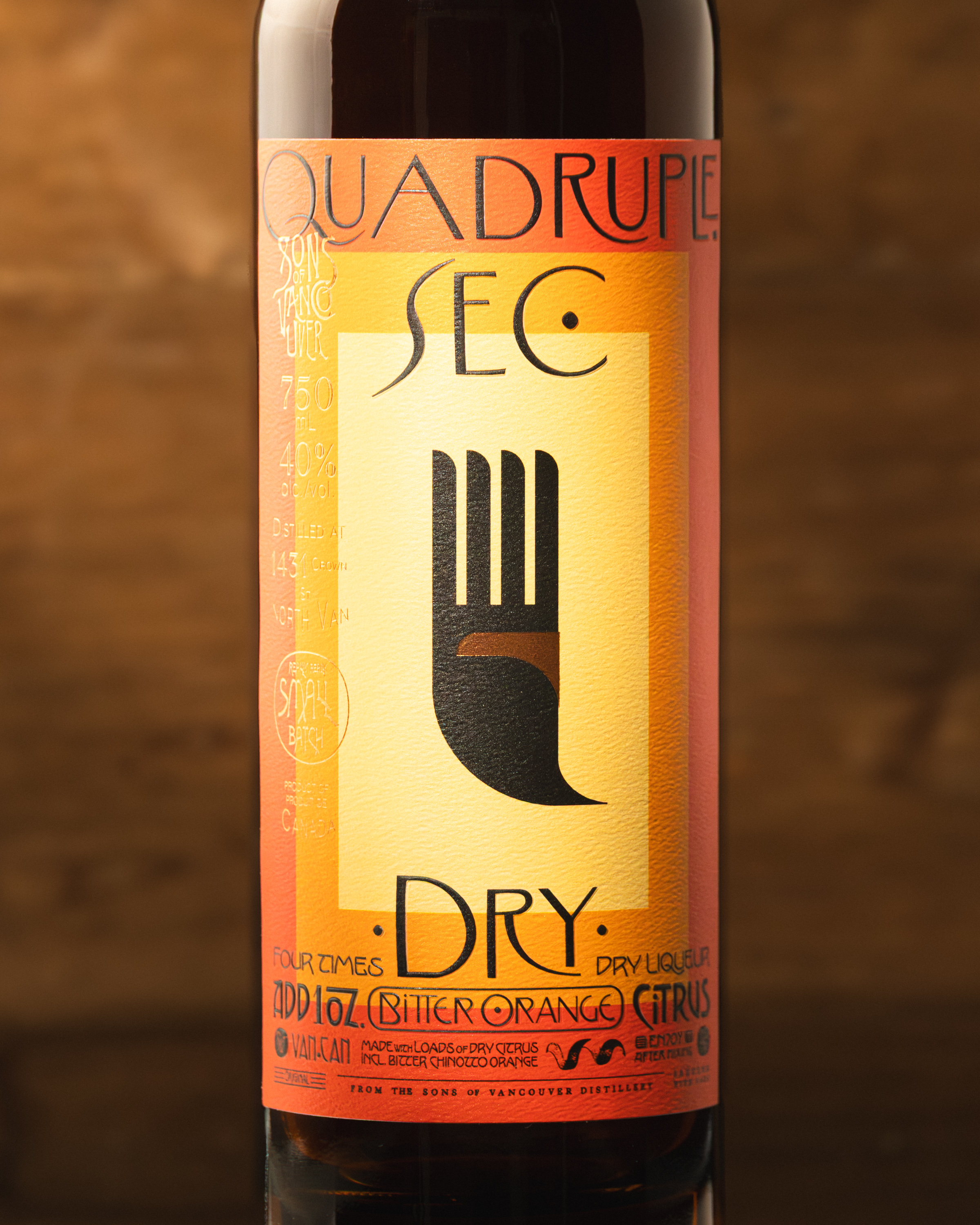 Sons of Vancouver Quadruple Sec label close-up in orange and amber tones